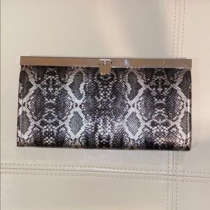 Bebe snake print clutch